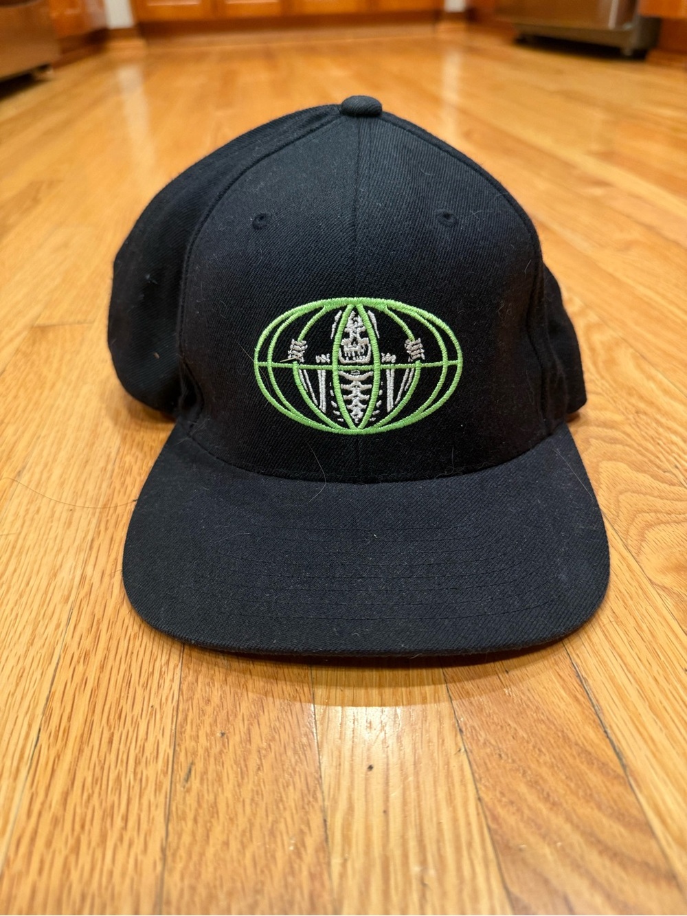 Skeleton Cage Black and Green Hat with Globe Embroidery